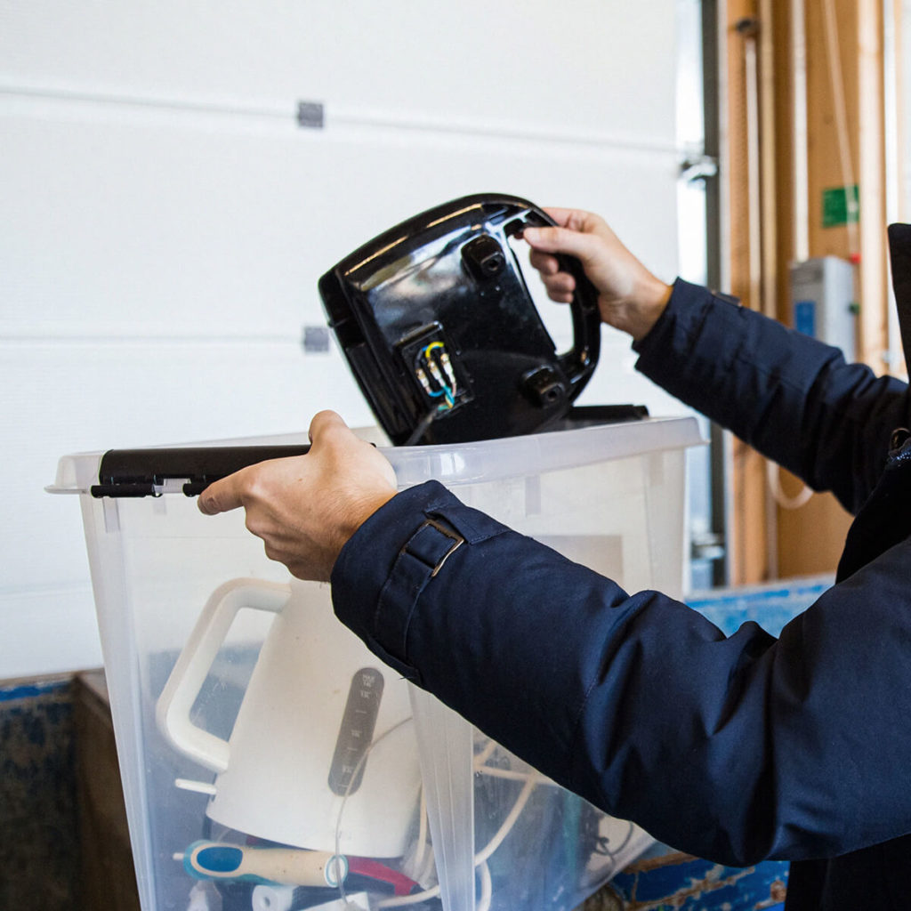 Person recycling unwanted electrical items