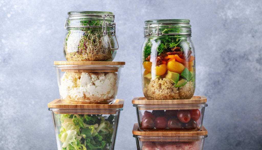 Glass food containers with different foods inside