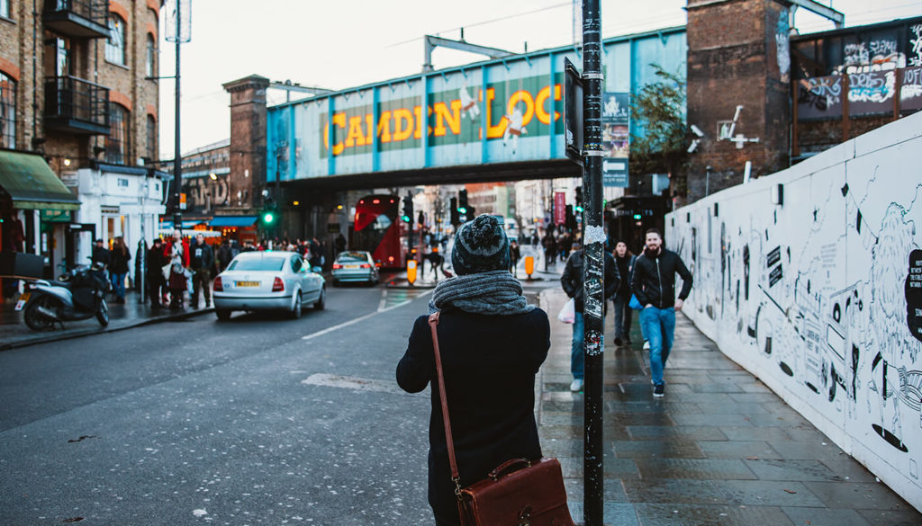 Urban London scene with pedestrians, cars and buses