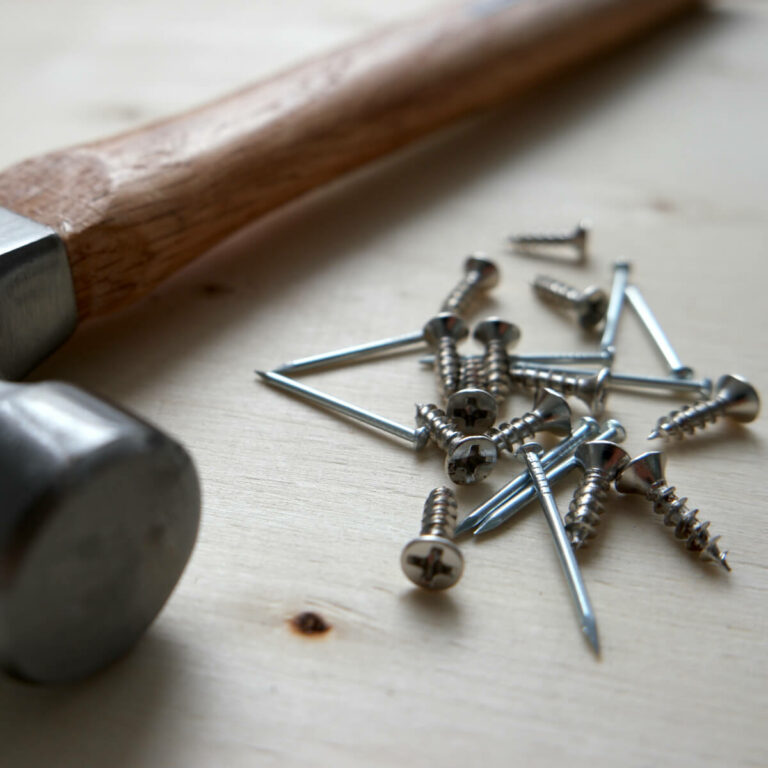 Screws and nails with hammer